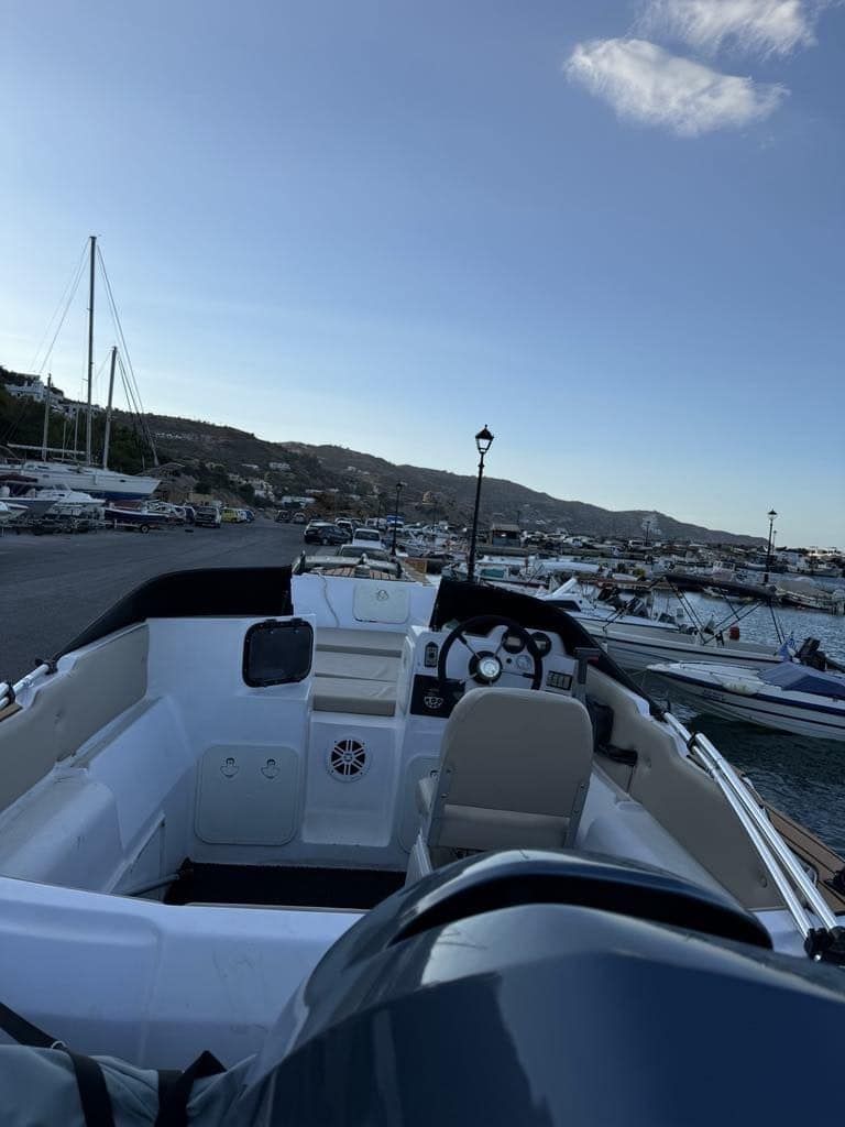 At the helm of the Άστρο, moored in the harbour